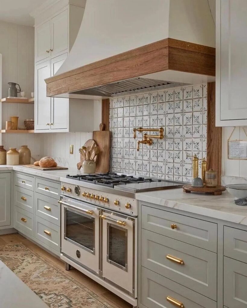 Patterned tile backsplash behind a professional gas range in a farmhouse style kitchen.