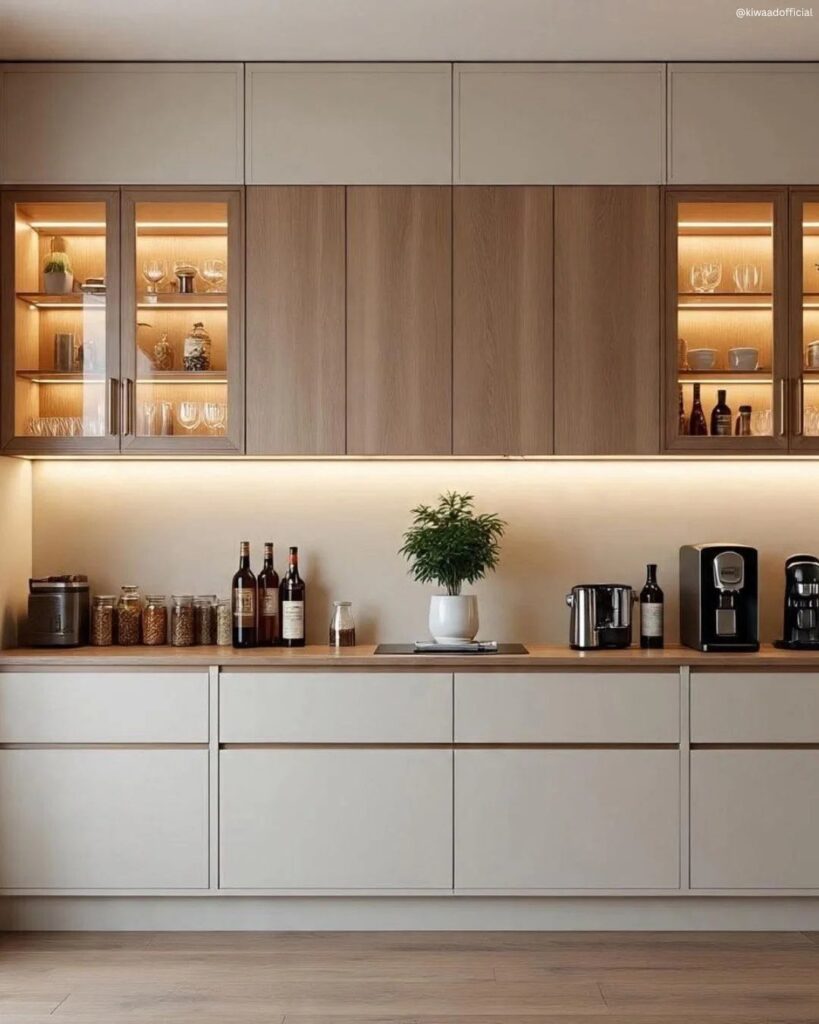 Modern kitchen with white cabinets, light wood accents, and a wooden countertop.